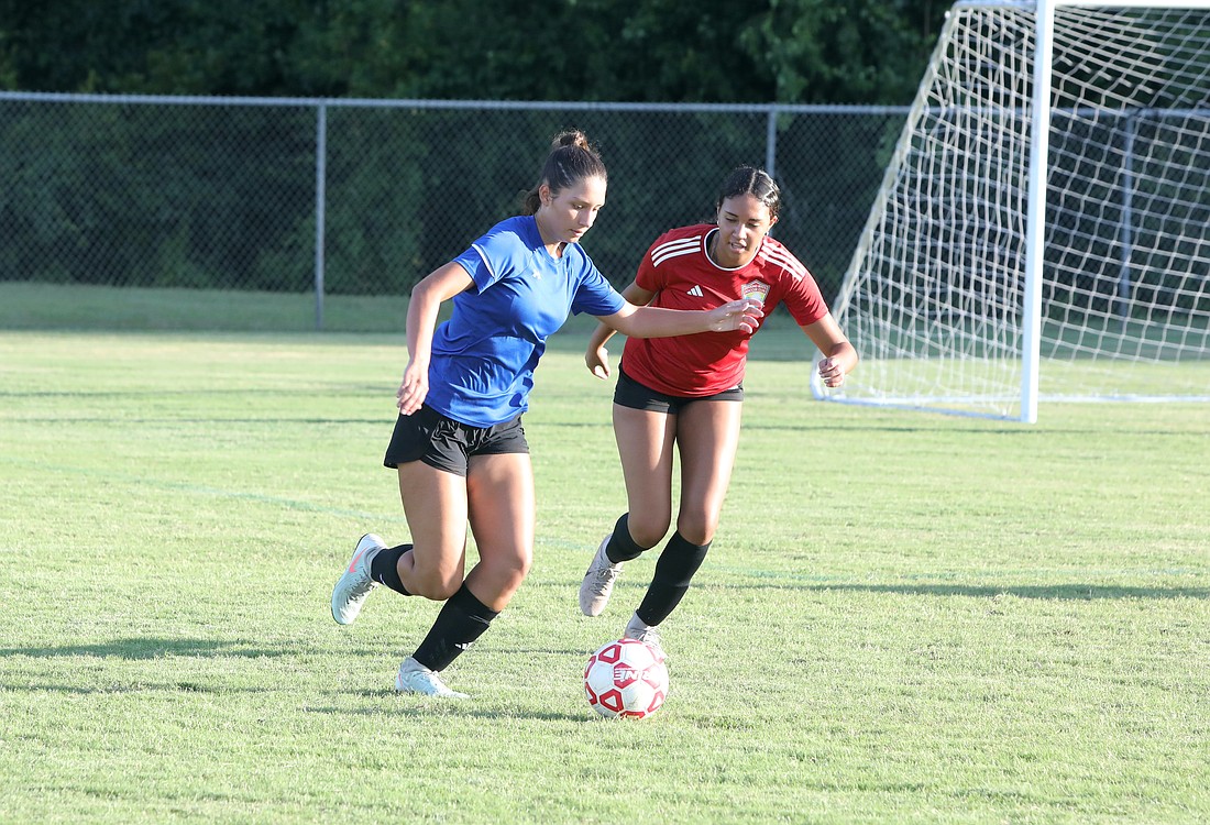 Seabreeze's Brieylle Long (right) goes after the ball in a 7v7 summer soccer league game on July 2 in Palm Coast. Photo by Brent Woronoff