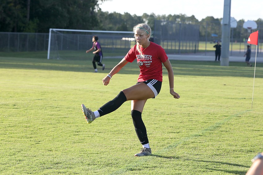 Seabreeze's Emma Robinson boots the ball upfield in a 7v7 summer soccer league game in Palm Coast. Photo by Brent Woronoff