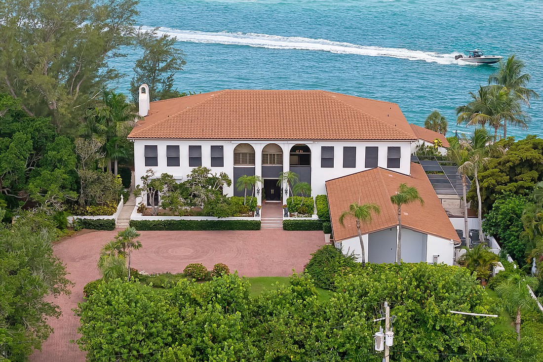 The 1.34-acre property features 247 feet of western shoreline.