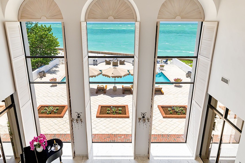 Windows overlook the pool and waterfront. Windows overlook the pool and waterfront.
