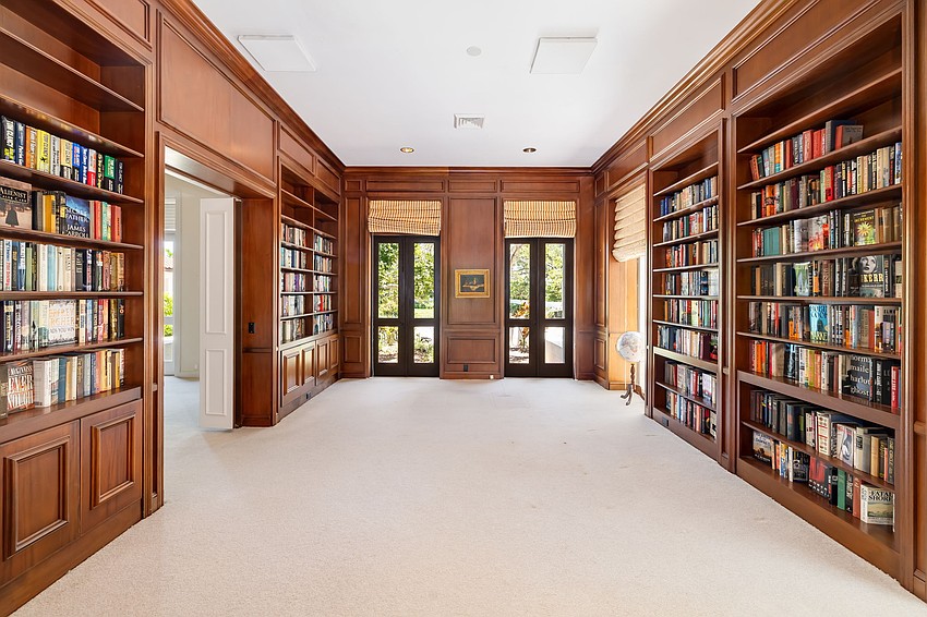 The library is among the amenities in the 9,100-square-foot home. The library is among the amenities in the 9,100-square-foot home.