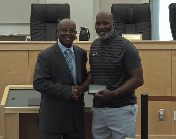 Mayor Derrick Henry presents Terry Anthony with the Key to the City and proclaims July 1 as "Terrence Anthony Day" during the July 1 Daytona Beach City Commission meeting in recognition of his selection as Florida's Male Educator of the Year.