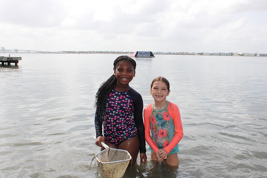 Campers Cameron Cox and Coco Olson were all smiles while dip netting for sea critters.