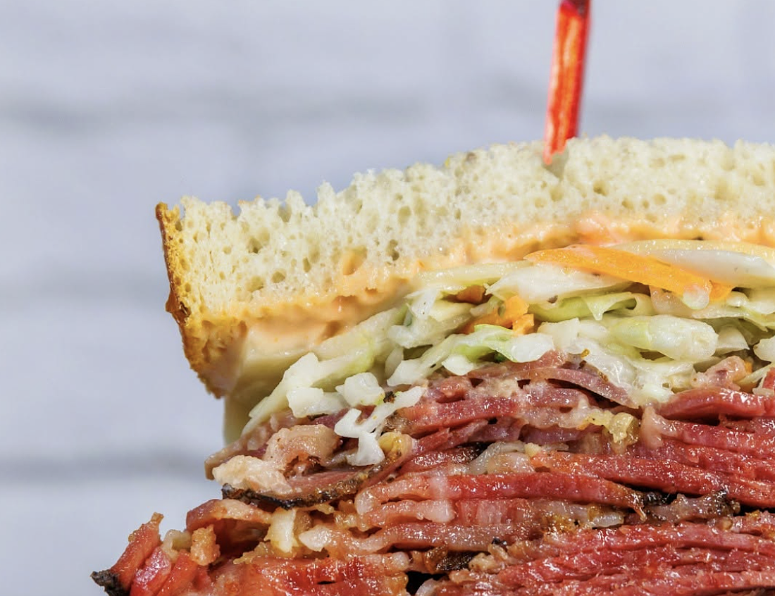 The Original Wolfie's menu includes sandwiches like Reuben, pastrami, corned beef and chicken salad, among others, plus bagels, breads, soups, salads and desserts.