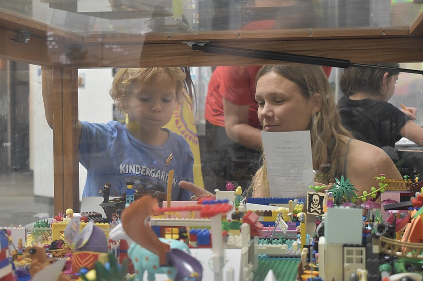 Koda Lanchuk, 5, and his mother Jada Sheeler, play an 