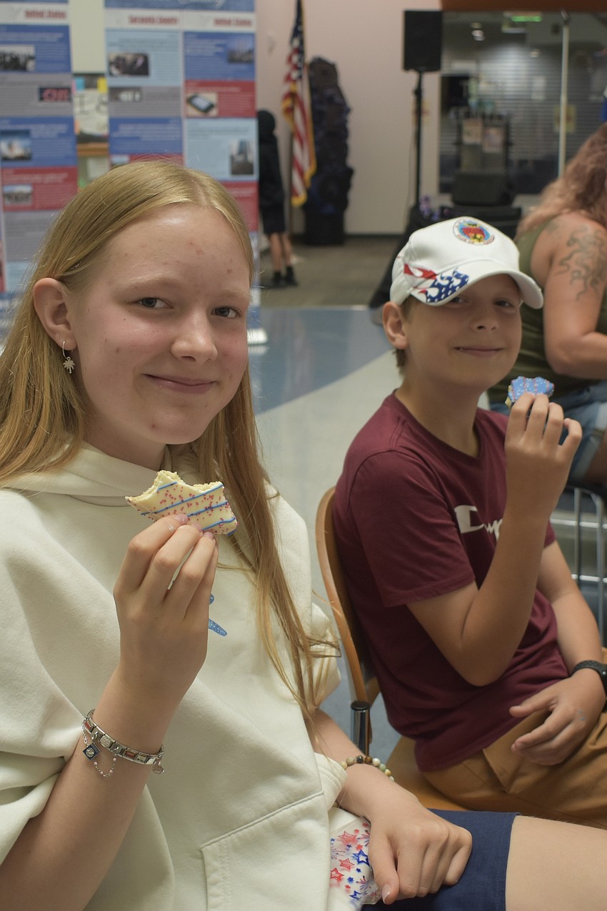 Elisabeth Hundertmark, 14, and Frederik Hundertmark, 11, enjoy patriotic cookies.
