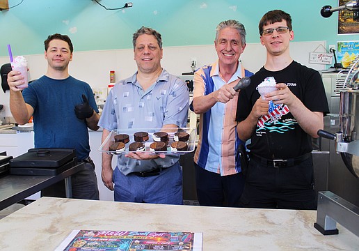 Logan Shaw, Wolfe Shaw, Michael Garey and Calvin Shaw, the team behind the new M & W Sweet Spot frozen treat shop on Longboat Key, showcase a variety of their offerings, including frozen custard sandwiches and drinks.