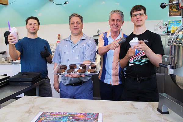 Logan Shaw, Wolfe Shaw, Michael Garey and Calvin Shaw, the team behind the new M & W Sweet Spot frozen treat shop on Longboat Key, showcase a variety of their offerings, including frozen custard sandwiches and drinks.