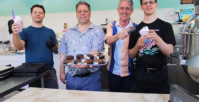 Logan Shaw, Wolfe Shaw, Michael Garey and Calvin Shaw, the team behind the new M & W Sweet Spot frozen treat shop on Longboat Key, showcase a variety of their offerings, including frozen custard sandwiches and drinks.