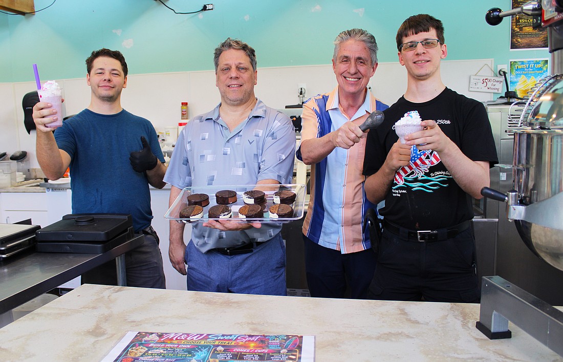 Logan Shaw, Wolfe Shaw, Michael Garey and Calvin Shaw, the team behind the new M & W Sweet Spot frozen treat shop on Longboat Key, showcase a variety of their offerings, including frozen custard sandwiches and drinks.