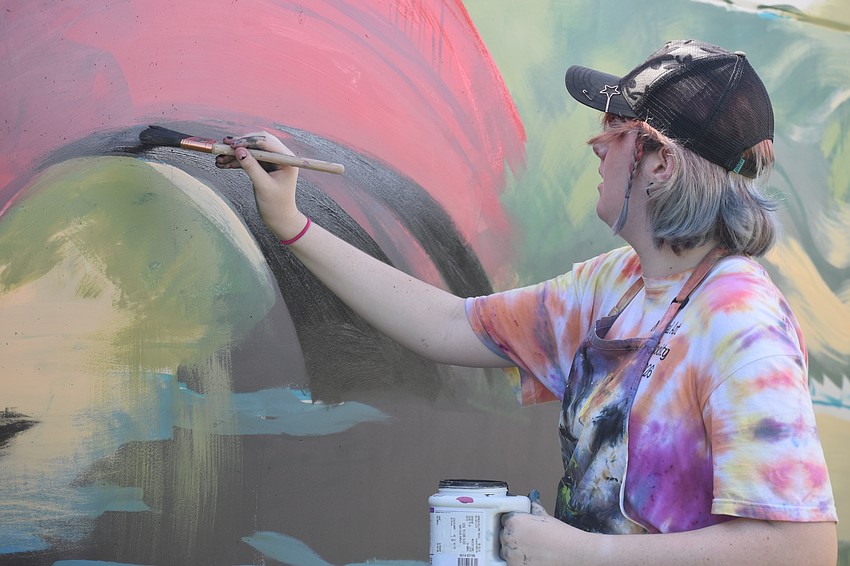 Ginger Kreithen paints a bridge in 