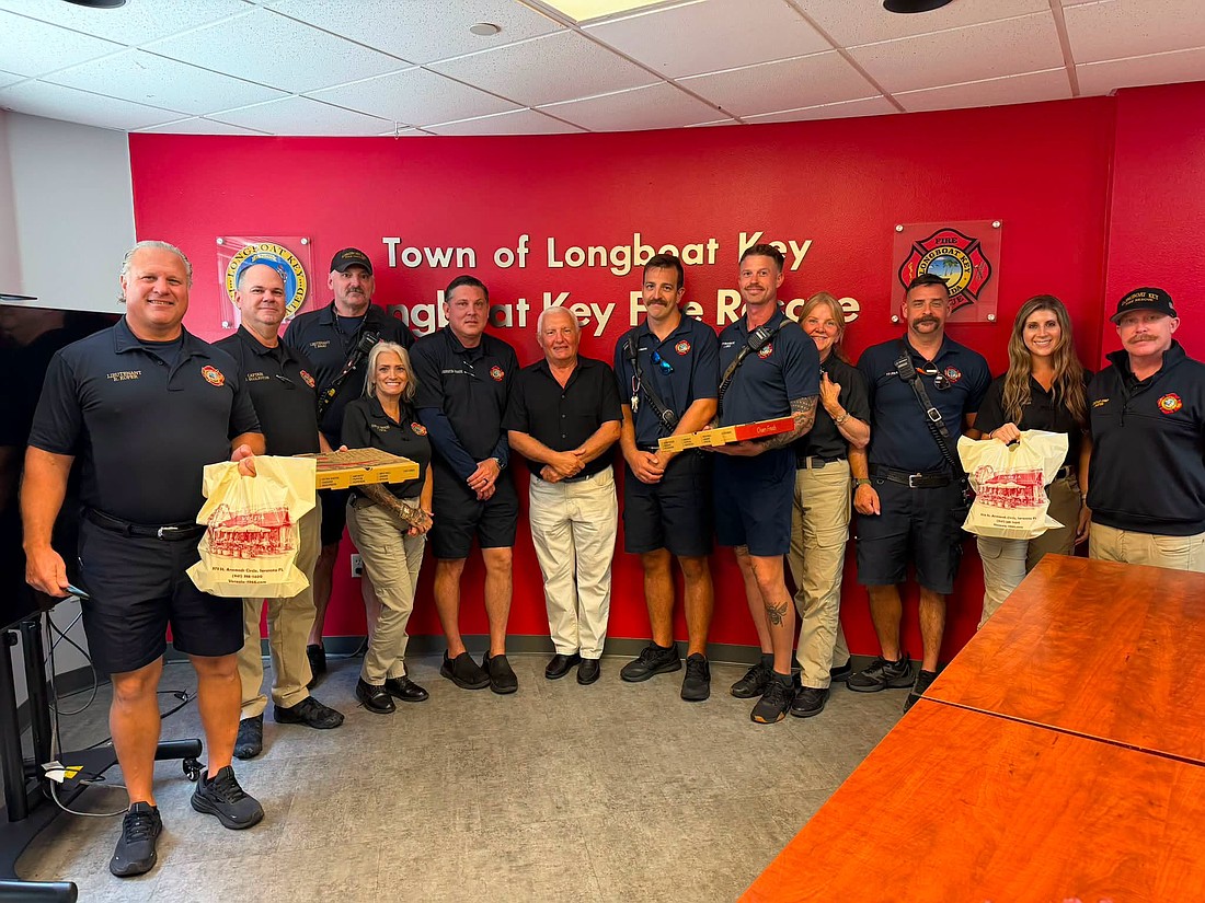 Alexander Fine (center) presented first responders from Longboat Key Fire Rescue with a pizza lunch last week for their efforts.
