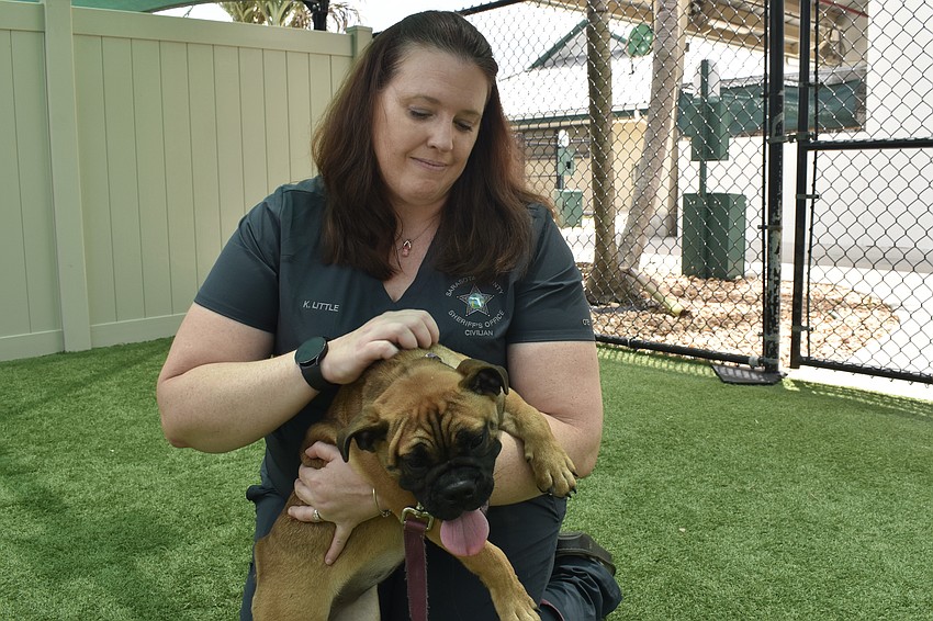 Kristen Little plays with Jubilee.
