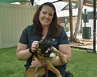 Kristen Little plays with Jubilee.