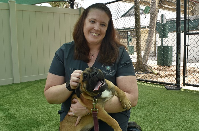 Kristen Little plays with Jubilee.