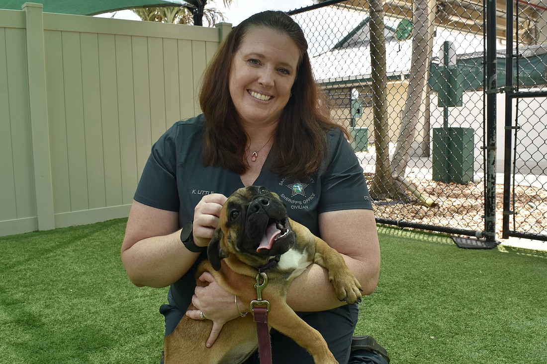 Kristen Little plays with Jubilee.