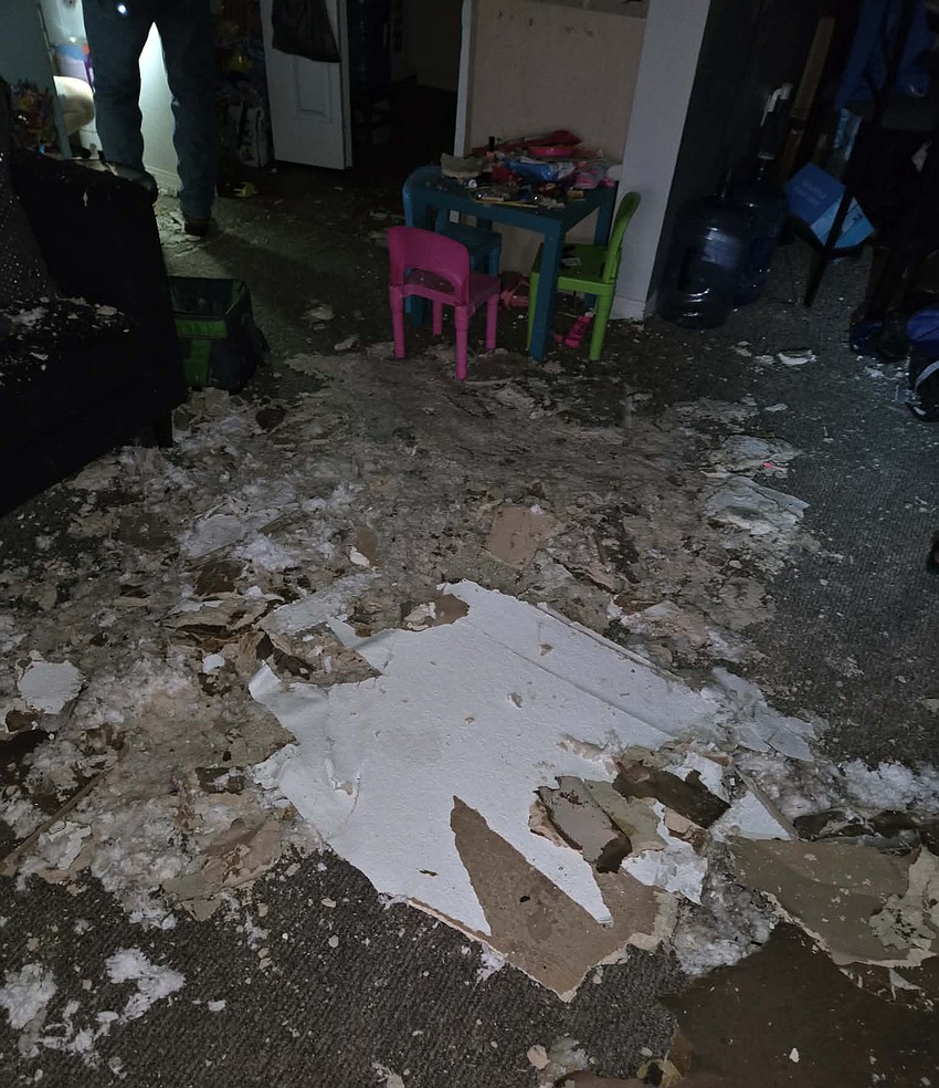 The family's living room was filled with debris.