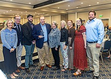 Visit Sarasota County President and CEO Erin Duggan (left), past President Virginia Haley (center), and Board Chair John LaCivita (second from left) recognize representatives of Watershed Hospitality Concepts with the 2026 Business Excellence Haley Award.