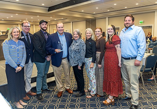 Visit Sarasota County President and CEO Erin Duggan (left), past President Virginia Haley (center), and Board Chair John LaCivita (second from left) recognize representatives of Watershed Hospitality Concepts with the 2026 Business Excellence Haley Award.