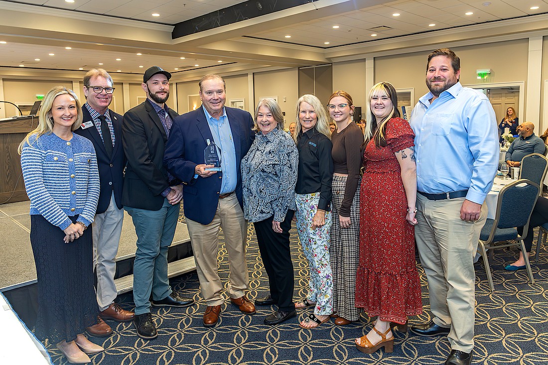 Visit Sarasota County President and CEO Erin Duggan (left), past President Virginia Haley (center), and Board Chair John LaCivita (second from left) recognize representatives of Watershed Hospitality Concepts with the 2026 Business Excellence Haley Award.