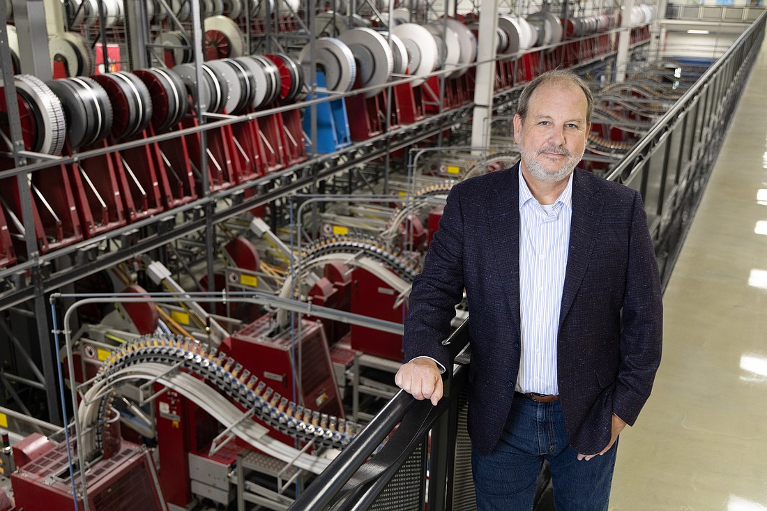 Chris Cate, president and CEO of Valpak, stands inside the company’s 470,000-square-foot print-and-mail facility in north St. Petersburg.