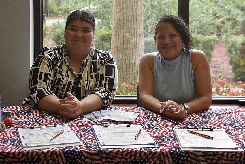 Jaymie Lopez and Rose Pallares man the Manatee County Supervisor of Elections table.