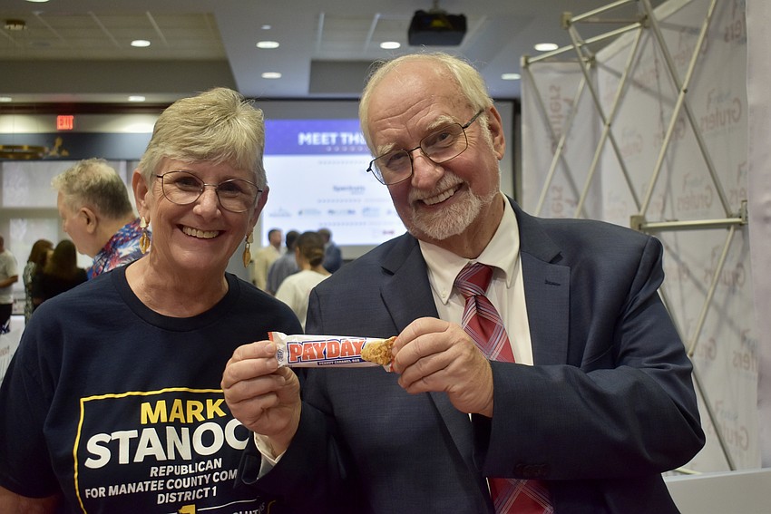 Annette and Mark Stanoch hand out Payday bars. Mark Stanoch is running for the District 1 seat on the Manatee County commission.