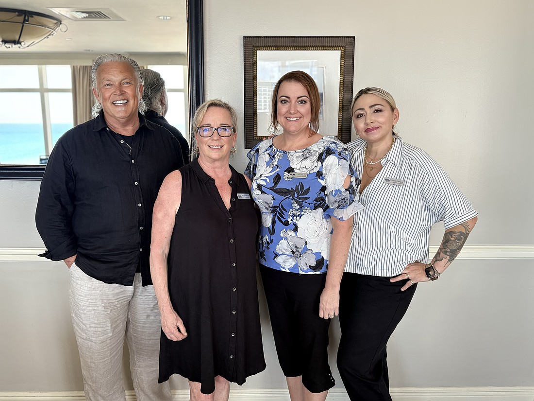 Roy Young, president and CEO of Halifax Urban Ministries; case manager Julie Ayers-Bernstein; Jamie Fay, executive assistant; and Nicole Campon marketing and development manager. Courtesy photo