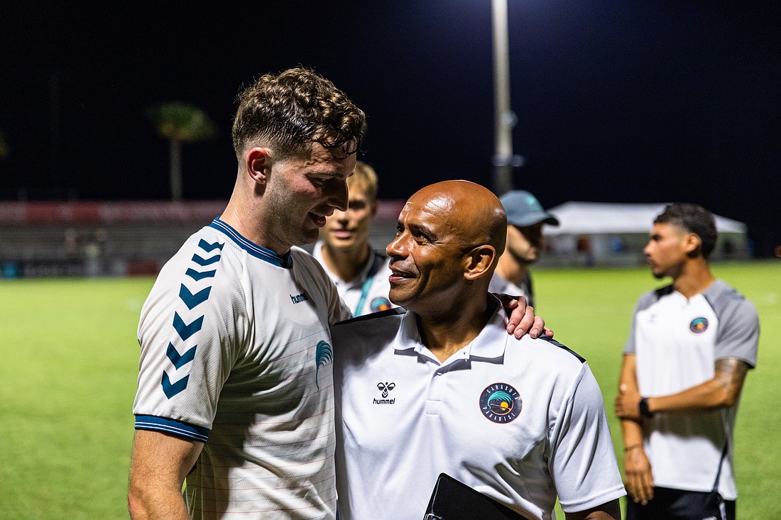 Defender Declan Watters (left) is one of several Sarasota Paradise players learning from lead assistant Trevor Sinclair (right). The Paradise are 5-10-3 in USL League One and 6-13-3 overall, as of July 16.