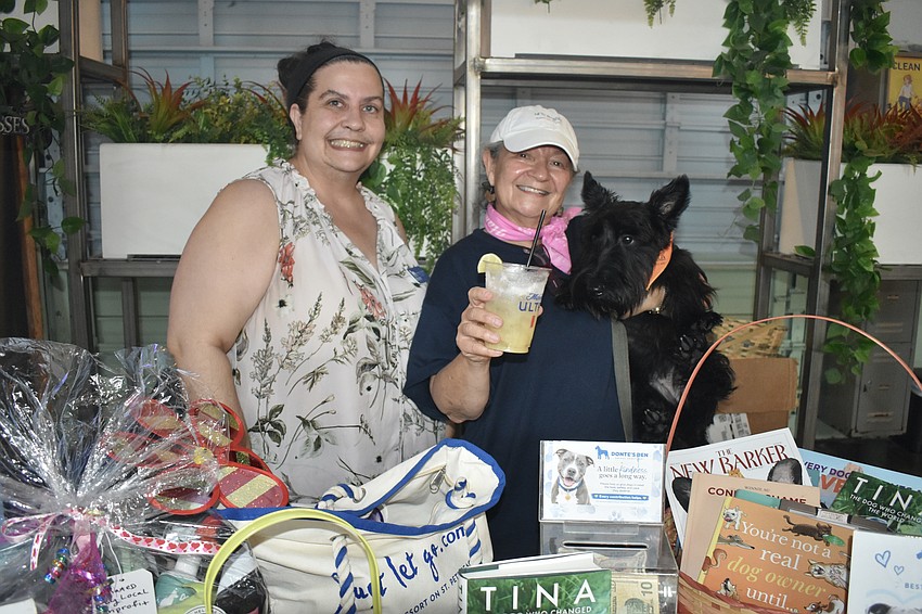 Claudia Harden, Anna Cooke and Cooper represent Donte's Den, the shelter that benefited from the event.