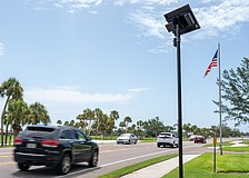 A Flock camera takes pictures of vehicles that drive on Gulf of Mexico Drive on Longboat Key.