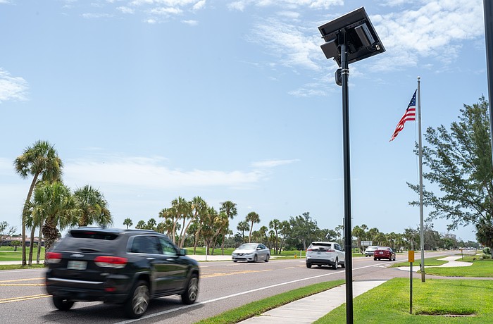 A Flock camera takes pictures of vehicles that drive on Gulf of Mexico Drive on Longboat Key.