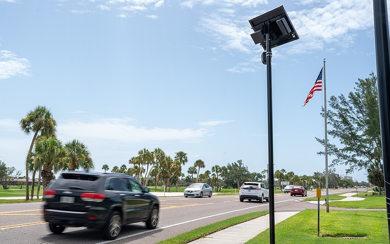 A Flock camera takes pictures of vehicles that drive on Gulf of Mexico Drive on Longboat Key.