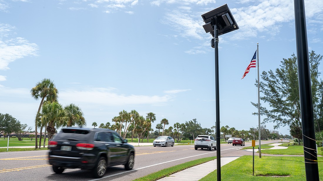 A Flock camera takes pictures of vehicles that drive on Gulf of Mexico Drive on Longboat Key.