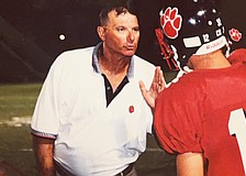 Bob Bowling (left) chews out his son, Matt Bowling (right), while coaching football at Palmetto High. Before Braden River, he worked at Palmetto from 1993-2004.