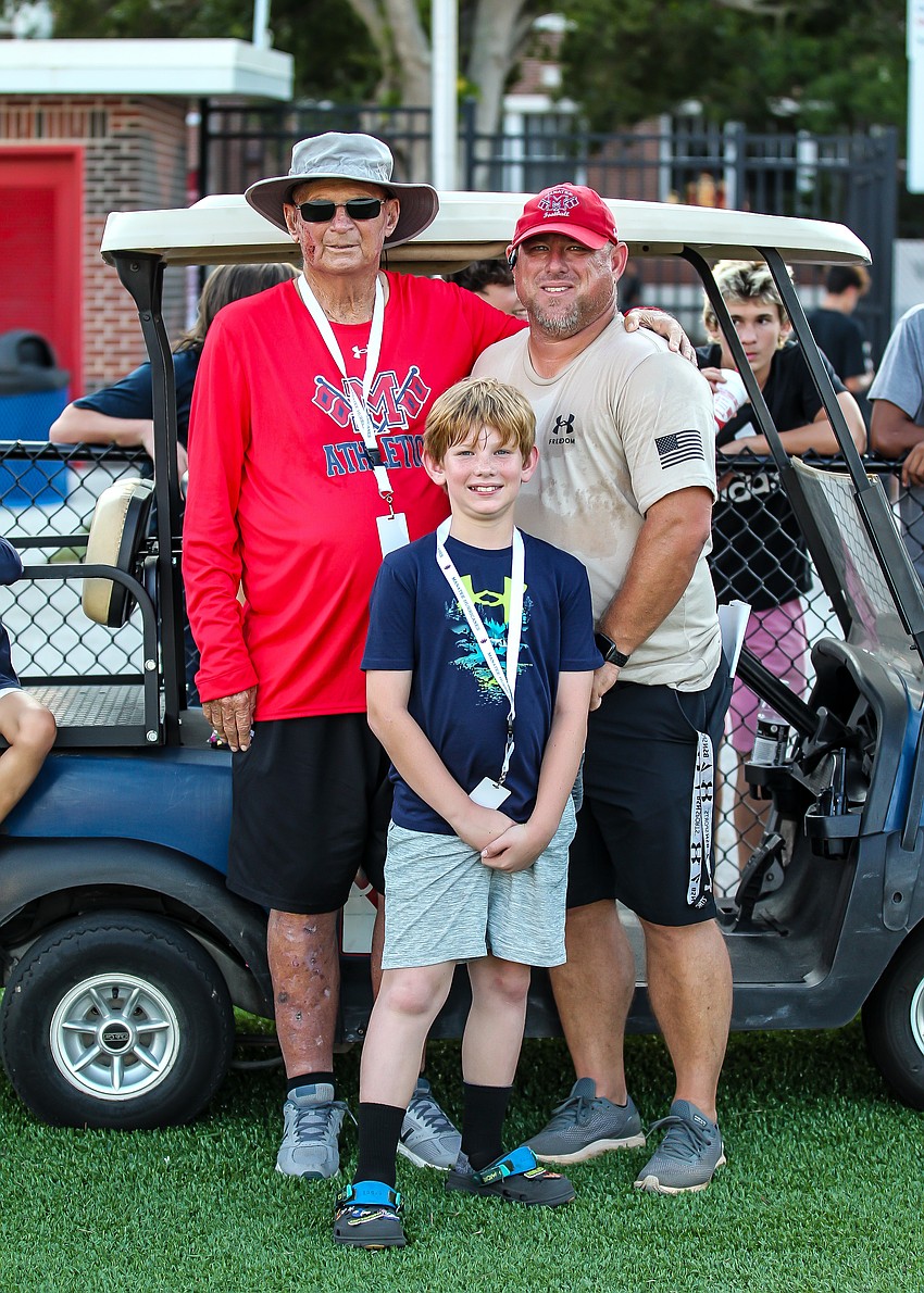 Bob Bowling (left), Matt Bowling (right) and Easton Bowling (center) at a Manatee High football game in September 2023. In 1966, Bob Bowling graduated from Manatee, and returned to coach there from 1976-78.
