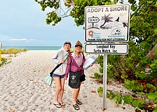 Mother-daughter duo Bridgette, left, and Giana Clark make a doubly positive difference in their community by monitoring sea turtle nests and clearing litter from the beach as volunteers with the Longboat Key Turtle Watch. The group recently celebrated seeing their new "Adopt A Shore" signage.
