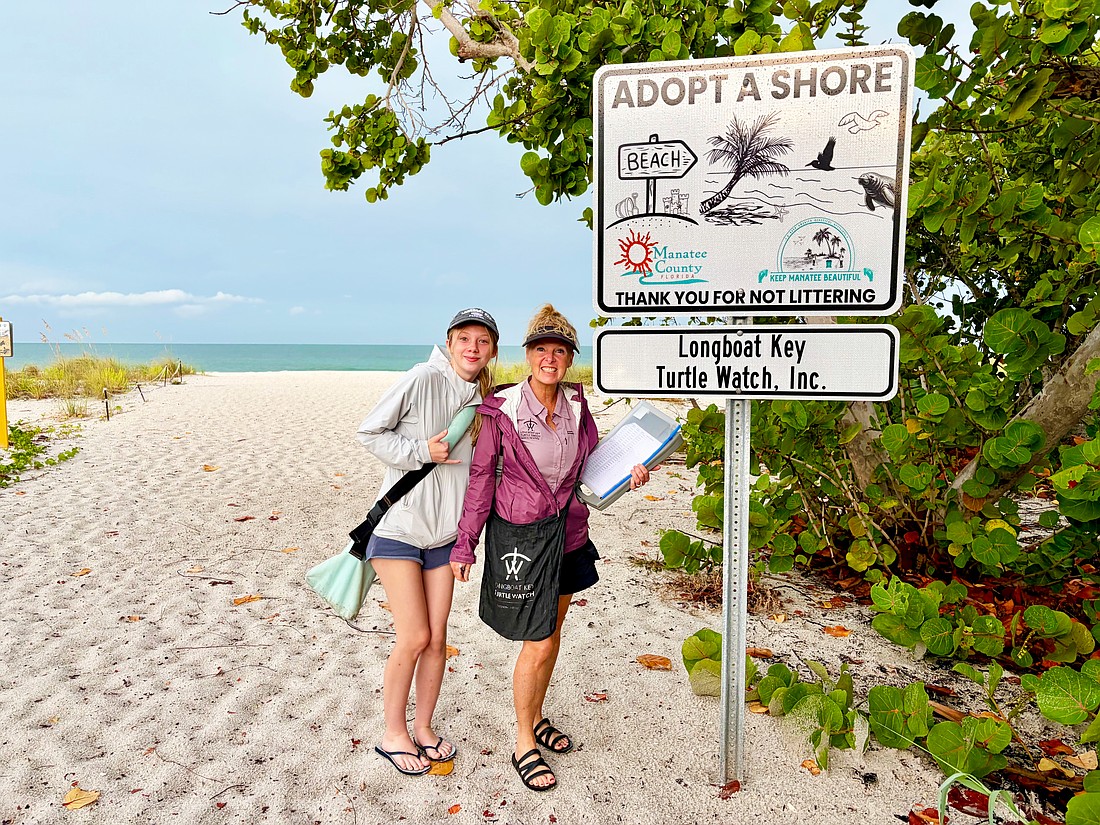 Mother-daughter duo Bridgette, left, and Giana Clark make a doubly positive difference in their community by monitoring sea turtle nests and clearing litter from the beach as volunteers with the Longboat Key Turtle Watch. The group recently celebrated seeing their new "Adopt A Shore" signage.