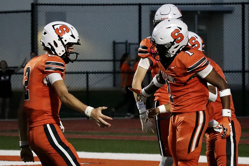 Rising junior quarterback Hudson West (left) goes for a high-five with rising senior wide receiver/cornerback Jayden Rivers (right). Rivers will be just one of several weapons at his disposal this fall. Rising junior quarterback Hudson West (left) goes for a high-five with rising senior wide receiver/cornerback Jayden Rivers (right). Rivers will be just one of several weapons at his disposal this fall.