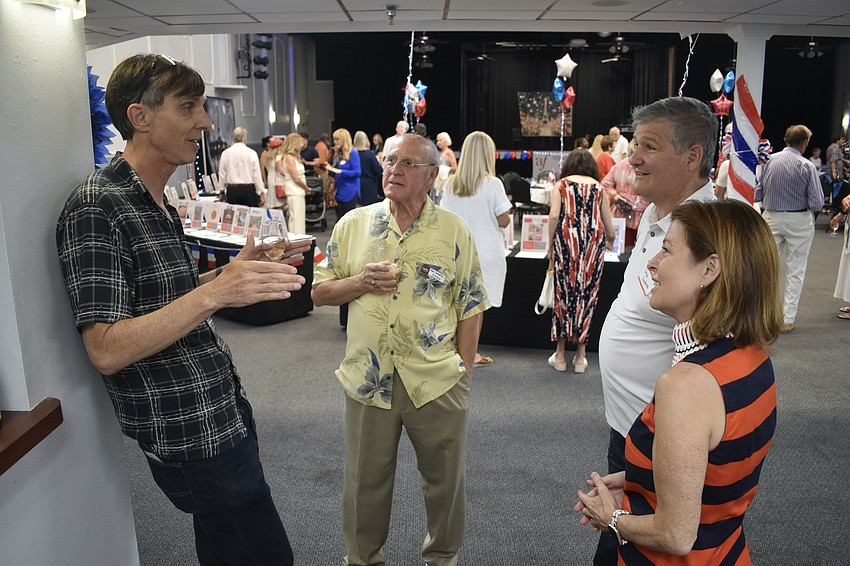 Jamie Allen, Jean Sebastian-Sardo, and Steve and Julia Cardone talk at Bastille Day.