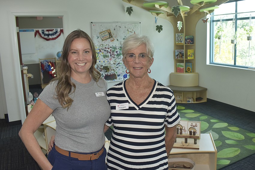 Pathways of Play owner and founder Ashley Hostetter and Helen Hreen, president of Alliance Française de Sarasota, stand in the facility at Pathways of Play.