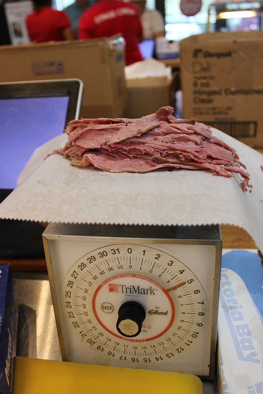 The meat gets weighed before any sandwich is made at The Original Wolfie's.