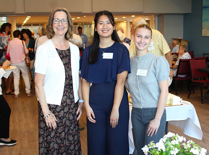 Judy Govalet, a member of Longboat Island Chapel's scholarship committee, brings students Danae Tran and Michelle McLeod to Shook Hall for a community reception. Tran, McLeod and three other students won academic scholarships from the chapel this year.
