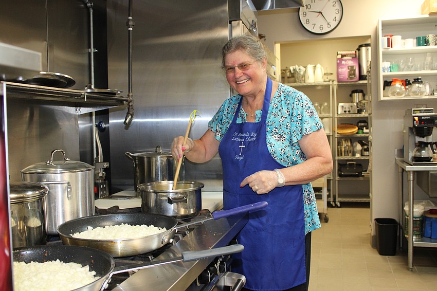 At St. Armands Key Lutheran Church, Juli Kampe pitches in to help cook a meal for Resurrection House. Volunteers with the church prepare lunch once a month for the Sarasota-based organization.