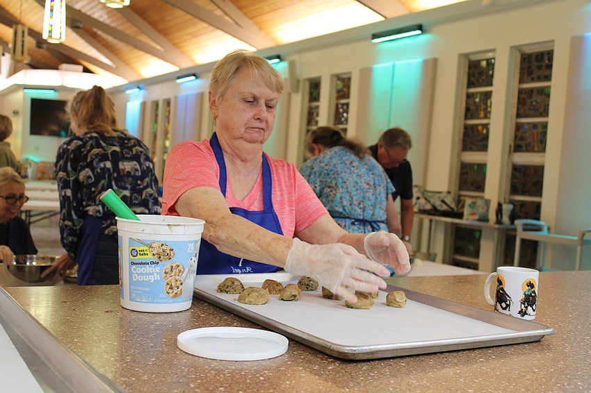 Denise Watermeier portions out cookie dough.