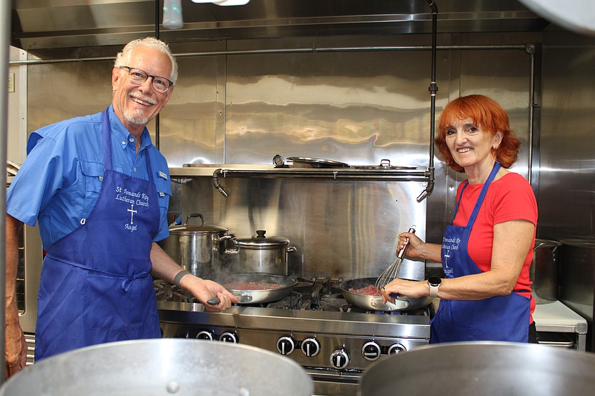 Ernie Smith and Chris Sturm keep things moving on the stove.