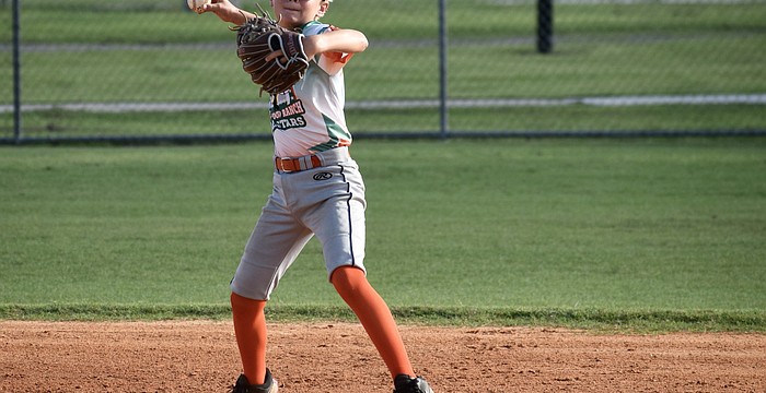 Henry Wainscott eyes first base with his throw during an around-the-horn drill at July 21 practice. He was one of 12 players who made up the 11U All-Stars — a team which finished 7-1 this summer.