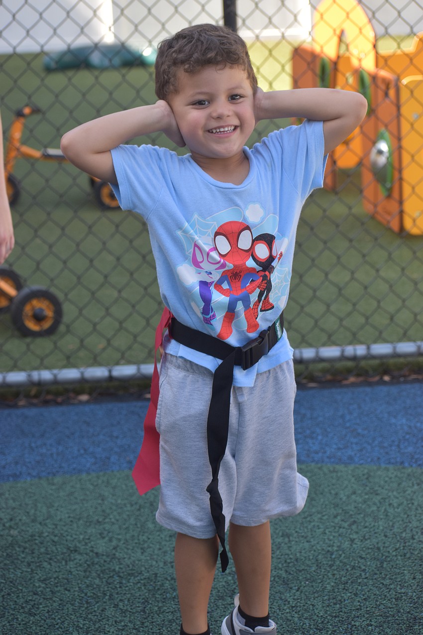 East County's Diego Pierral, 4, gets ready to play flag football by dancing.