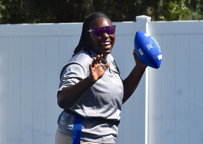 Nyzirria Curry, a preschool teacher at The Learning Experience, says flag football is a great way for the kids to play as a team and grow.