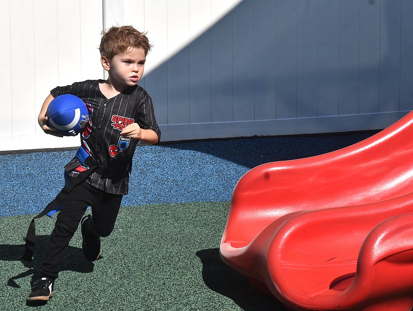 East County's Oliver Mechling, 3, decided to take this run off the field and through the playground.